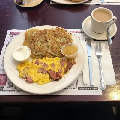 Hearty breakfast platter with eggs and coffee
