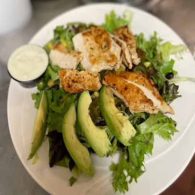 Fresh salad with grilled chicken and avocado